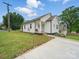 Charming home with a well-manicured lawn and a long driveway at 900 4Th St, Spencer, NC 28159
