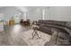 Bright, open living area with gray vinyl floors, perfect for entertaining and relaxing at 900 4Th St, Spencer, NC 28159