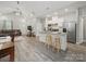Open-concept living space with kitchen island, seamlessly flowing into the dining and living areas at 900 4Th St, Spencer, NC 28159