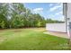 Lush green backyard with a privacy fence, ideal for outdoor activities and relaxation at 9009 Odell Corners Nw Blvd, Concord, NC 28027