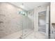Luxurious bathroom with walk-in shower showcasing stylish tile and glass enclosure with marble floors at 9009 Odell Corners Nw Blvd, Concord, NC 28027