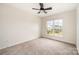 Bedroom with carpet and a window showing the view to the neighborhood at 9009 Odell Corners Nw Blvd, Concord, NC 28027