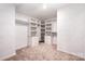 Walk-in closet features custom shelving and drawers, providing plenty of storage space at 9009 Odell Corners Nw Blvd, Concord, NC 28027