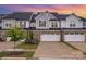 Charming townhome with brick accents, a two-car garage, and well-manicured landscaping at 9009 Odell Corners Nw Blvd, Concord, NC 28027