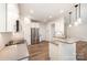 Stylish kitchen with stainless steel appliances, and stone countertops, with a view of the adjacent living space at 9009 Odell Corners Nw Blvd, Concord, NC 28027