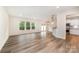 Inviting living room with hardwood floors, large windows, and open layout at 9009 Odell Corners Nw Blvd, Concord, NC 28027