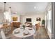 Inviting living room featuring hardwood floors, modern lighting, and comfortable seating arrangements at 9009 Odell Corners Nw Blvd, Concord, NC 28027