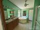 Full bathroom featuring a double sink vanity, soaking tub, and a separate shower area at 9044 Forington Ln, Gastonia, NC 28056