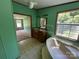 Bathroom with a double sink vanity, soaking tub, and bright, natural light at 9044 Forington Ln, Gastonia, NC 28056