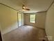 Bedroom featuring a window and ceiling fan at 9044 Forington Ln, Gastonia, NC 28056