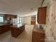 Traditional kitchen featuring wooden cabinets, island, and tile flooring throughout space at 9044 Forington Ln, Gastonia, NC 28056