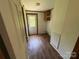 Functional mud room features tiled floors, hanging cabinet, and exterior access at 9044 Forington Ln, Gastonia, NC 28056
