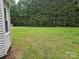 Large flat backyard with mature trees at 905 Klondale St, China Grove, NC 28023