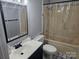 Bathroom features a shower-tub combination and black and white patterned flooring at 905 Klondale St, China Grove, NC 28023