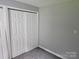 Bedroom closet features newer white painted doors and updated gray paint at 905 Klondale St, China Grove, NC 28023