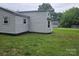 Exterior side view of the home shows gray vinyl siding and updated windows at 905 Klondale St, China Grove, NC 28023