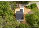 Aerial view of a home showcasing its roof and surrounding landscape and driveway at 105 Spring Garden Dr, Gastonia, NC 28052