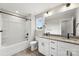 Bathroom featuring a shower-tub, granite top vanity, and modern fixtures at 105 Spring Garden Dr, Gastonia, NC 28052