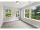 Bedroom with neutral walls, carpet, and multiple windows at 105 Spring Garden Dr, Gastonia, NC 28052