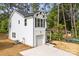 Angle view of a charming two-story home with a white exterior and a one-car garage at 105 Spring Garden Dr, Gastonia, NC 28052