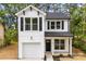 Charming two-story home with a white exterior, black shutters and a one-car garage at 105 Spring Garden Dr, Gastonia, NC 28052