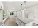 Open kitchen with granite island flows into a spacious living area, perfect for modern living at 105 Spring Garden Dr, Gastonia, NC 28052