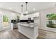 Bright kitchen features white cabinetry, granite countertops, stainless steel appliances, and an island at 105 Spring Garden Dr, Gastonia, NC 28052