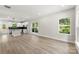 Spacious living room with light wood floors, large windows and an open floor plan at 105 Spring Garden Dr, Gastonia, NC 28052