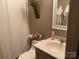 Bathroom featuring vanity, a toilet, and shower/tub combination with white tiling at 1115 John Short Rd, Indian Land, SC 29707