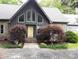 Beautiful home with a lovely garden leading to the yellow front door at 1115 John Short Rd, Indian Land, SC 29707