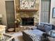 Cozy living room features a stone fireplace and ample seating at 1115 John Short Rd, Indian Land, SC 29707