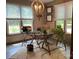 Home office featuring a glass desk, stone accent wall, and plenty of natural light at 1115 John Short Rd, Indian Land, SC 29707