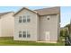 Back exterior of home, featuring a back door and windows at 124 Canada Dr # 45, Statesville, NC 28166