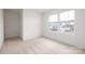 Bright bedroom featuring plush carpet, large windows, and neutral paint, creating a calming atmosphere at 124 Canada Dr # 45, Statesville, NC 28166