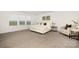 Cozy bedroom with soft carpet, a large window, and modern furniture at 124 Canada Dr # 45, Statesville, NC 28166