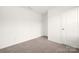 Neutral bedroom with carpet flooring and door, perfect for relaxation at 124 Canada Dr # 45, Statesville, NC 28166