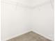 A walk-in closet features shelving for storage and organization at 124 Canada Dr # 45, Statesville, NC 28166