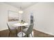 Cozy dining area featuring modern decor, stylish lighting, and an adjacent door to the backyard at 124 Canada Dr # 45, Statesville, NC 28166