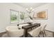 Inviting dining area featuring a chandelier, ample natural light, and modern décor at 124 Canada Dr # 45, Statesville, NC 28166