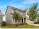 Charming two-story home with a two-car garage, inviting front porch and mature landscaping at 124 Canada Dr # 45, Statesville, NC 28166