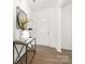 Inviting foyer with a decorative table, mirror, and sleek hardwood floors at 124 Canada Dr # 45, Statesville, NC 28166