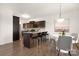 Eat-in kitchen with a breakfast bar, dark wood cabinets, and stainless steel appliances at 124 Canada Dr # 45, Statesville, NC 28166