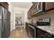 Modern kitchen with stainless steel appliances, granite countertops and dark wood cabinets at 124 Canada Dr # 45, Statesville, NC 28166