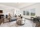 Bright living room featuring a cozy seating arrangement and large windows for natural light at 124 Canada Dr # 45, Statesville, NC 28166