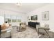 Bright living room with modern furnishings, neutral tones, and large windows that provide ample natural light at 124 Canada Dr # 45, Statesville, NC 28166