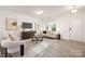 Inviting living room featuring modern decor, large windows, and an abundance of natural light at 124 Canada Dr # 45, Statesville, NC 28166
