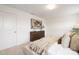 A spacious bedroom with neutral tones, carpeted floors, large windows, and a plush bed with decorative pillows at 124 Canada Dr # 45, Statesville, NC 28166