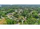 A lushly landscaped neighborhood with mature trees surrounds this charming home near a lake at 133 37Th Avenue Nw Pl, Hickory, NC 28601