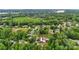 A captivating aerial view of a tree-lined neighborhood with a charming house and a lake nearby at 133 37Th Avenue Nw Pl, Hickory, NC 28601