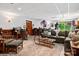 Basement with a lounge area, bar, office area, and outdoor access at 133 37Th Avenue Nw Pl, Hickory, NC 28601